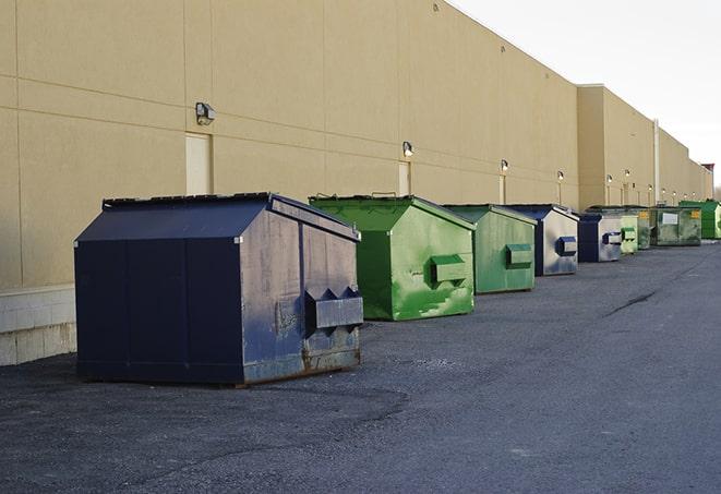 dumpsters with safety cones in a construction area in Alloway